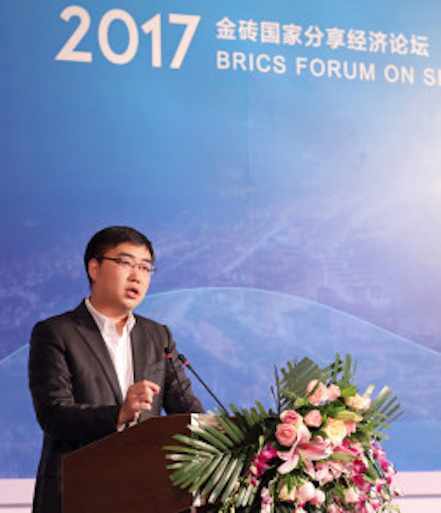 Didi founder Cheng Wei speaking at the BRICS Shari