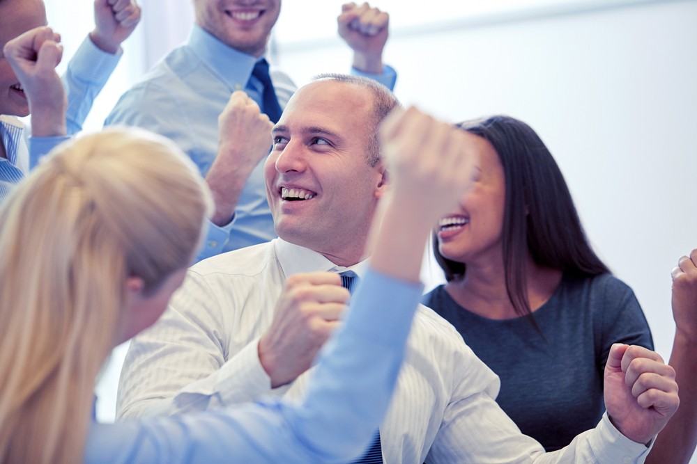 shutterstock_507814855_man_cheers_happy_work.jpg