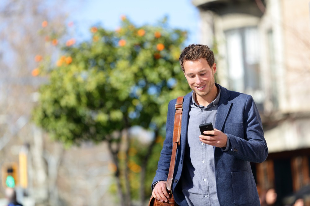 man walk phone shutterstock